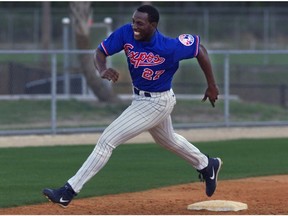 Expos outfielder Vladimir Guerrero flies around third base during base running drill at training camp at Jupiter, Fla.