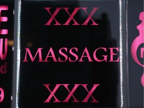 An erotic massage parlour advertises in neon in the Montreal area.