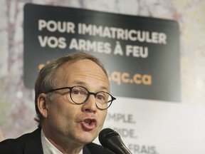 Quebec Public Security Minister Martin Coiteux announces details of Quebec's long-gun registry during a news conference in Montreal on Sunday, Jan. 28, 2018.