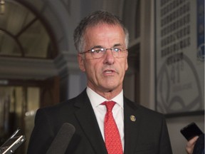 Back on Nov. 21, 2017, Quebec MNA Guy Ouellette responds to reporters questions after they announced he was reintegrated in the government caucus.
