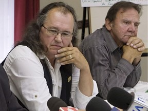 Over the years, Pierre Bolduc, left, and Roger Lessard have pushed for reforms to Quebec's civil laws that set time limits on sexual assault cases. Here, they attend a news conference in Quebec City in 2014 — one of many instances in which they lobbied for change.