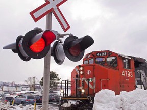 A CN locomotive moves in the railway yard in Dartmouth, N.S. on February 23, 2015. The potential dismantling of the North American Free Trade Agreement poses the biggest risk to Canada's railways not benefiting this year from healthy economies and higher demand to move crude oil, say industry observers.