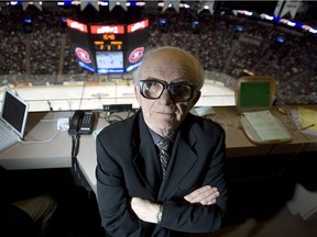 Red Fisher stands in front of his seat in Bell Centre press box during game between the Canadiens and the Toronto Maple Leafs on Sept. 24, 2005.