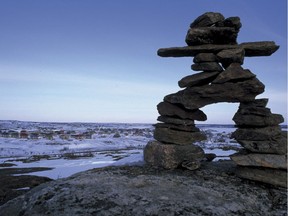 An Inukshuk overlooks the village of Kuujjuaq. Sick children in such northern Quebec communities are often airlifted to Montreal for treatment without family members accompanying them.