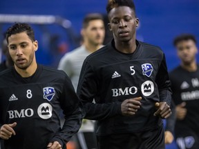 Montreal Impact midfielder Saphir Taïder, left, and defender Zakaria Diallo during practice at Olympic Stadium in Montreal on Thursday Feb. 1, 2018.