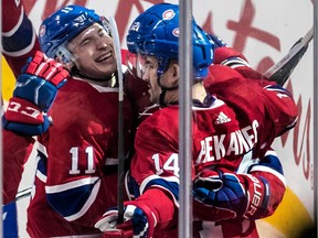 Canadiens' Artturi Lehkonen is congratulated by teammates Brendan Gallagher and Tomas Plekanec after Lehkonen scored his second goal of the second period at the Bell Centre on Sunday, Feb. 4, 2018.