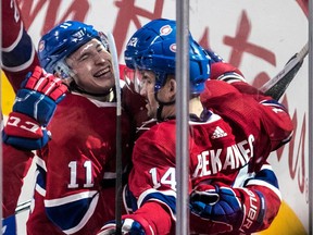 Canadiens forward Artturi Lehkonen (62) is congratulated by teammates Brendan Gallagher (11) and Tomas Plekanec (14) after scoring his second goal of the game in a 4-1 win over the Ottawa Senators at the Bell Centre in Montreal on Feb. 4, 2018.