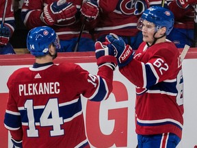 Montreal Canadiens left wing Artturi Lehkonen (62) is congratulated by centre Tomas Plekanec (14) after Lehkonen's second-period power play goal at the Bell Centre on Feb. 4, 2018.