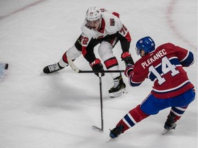Montreal Canadiens centre Tomas Plekanec (14) steals the puck from Ottawa Senators defenceman Thomas Chabot (72) and scores on Ottawa Senators goaltender Mike Condon (1) during 3rd period NHL action at the Bell Centre, on Sunday, February 4, 2018.