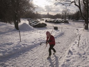 A cross-country skier makes her way toward Beaver Lake on Mount Royal. A pilot project would block drivers from using Camillien-Houde Way/Remembrance Rd. as an east-west artery.