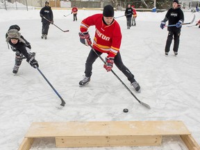 Poor ice conditions took the Subzero Pond Hockey Tournament off the river in Hudson and into the town centre. Pictured is Team Gamache taking on team Nurun at the inaugural tournament on Saturday.