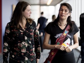 Allison Reid, left, is seen with Nakuset during a break at inquiry in Montreal on Wednesday, Feb. 14, 2018.