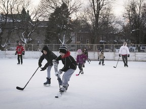 Skaters play a game of shinny hockey at N.D.G. park on Tuesday, Feb. 13, 2018.