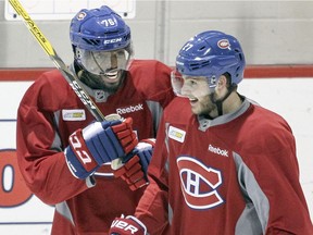 P.K. Subban jokes with teammate Alex Galchenyuk during practice at the team's training facility in Brossard on Feb. 19, 2016.