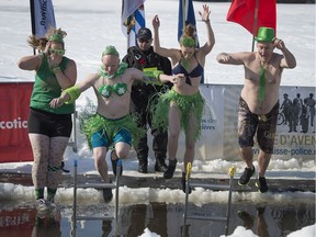 Members of the United Irish Societies of Montreal Shannon Pine (from left), Danny Doyle, Veronique Buisson and Ken Quinn take the plunge during the Lachine Winter Carnival in 2017.