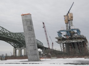 Part of the main pylon of the cable-stayed section of the new Champlain bridge, right, and the legs on the south shore of the work site on Friday February 23, 2018.