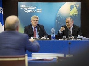 President Denis Bergeron, left, and commissary John Haemmerli of Bureau d'audiences publiques sur l'environnement (BAPE) at hearings about the plan to establish an aviation fuel terminal in Montreal East, at Centre Roussin on Tuesday.