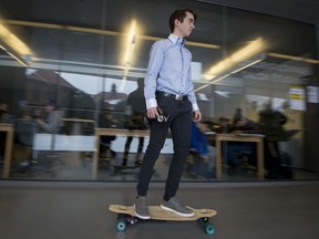 Nicolas Roy rides through the halls of John Abbott College in Ste-Anne-de-Bellevue on a motorized longboard. Roy and other students of the John Abbott College Engineering Technologies department showcased their original projects last Wednesday.