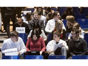 Pierrefonds Comprehensive High School students, from left, Michael Lopes, Eva Wanat, Angel Boutas and Matthew Diamond, who represent Afghanistan during a Model UN in Pierrefonds on Tuesday.