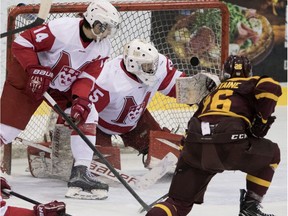 Stingers' Raphael Lafontaine scores the opening goal against Redman goalie Louis-Philip Guindon Wednesday night at McConnell Arena.