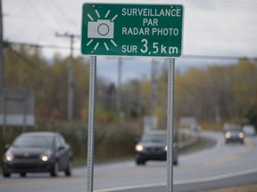 Signs posted along Cite des Jeunes Blvd.in St Lazare indicating that photo radar cameras now monitor drivers for speed.
