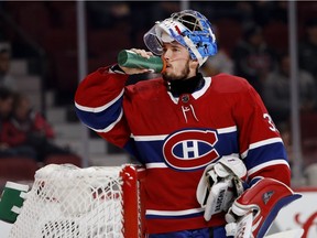 Canadiens goalie Charlie Lindgren takes a water break during NHL game against the Columbus Blue Jackets at the Bell Centre in Montreal on Nov. 14, 2017.