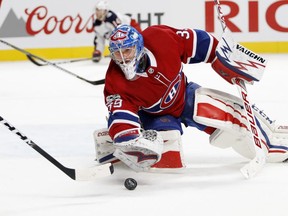 Montreal Canadiens goalie Charlie Lindgren plays the puck during action against the Columbus Blue Jackets in Montreal on Nov. 14, 2017.