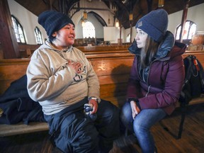 Nurse Margaux Pontoreau-Bazinet, right, listens to Grace Blacksmith at the Open Door shelter in Montreal last year.