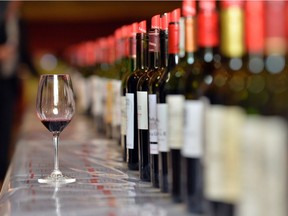 Wine bottles set out for tasting in the Dominican convent room in Saint-Emilion on April 5, 2016.