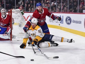 Canadiens' Karl Alzner takes down Predators' Ryan Johansen at the Bell Centre on Saturday, Feb. 10, 2018.