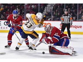 Canadiens goaltender Carey Price prepares to cover the puck as Predators' Viktor Arvidsson tries to grab the rebound at the Bell Centre on Saturday, Feb. 10, 2018, in Montreal.