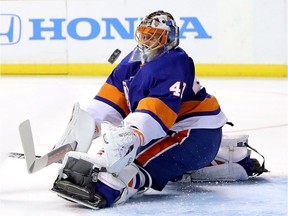 Jaroslav Halak of the New York Islanders blocks a Columbus Blue Jackets shot at the Barclays Center in New York City on Feb. 18, 2018.