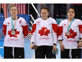 Team Canada's Jocelyne Larocque, centre, refuses to wear her silver medal after losing to the United States in the Women's Gold Medal Game at the PyeongChang 2018 Winter Olympic Games on Feb. 22, 2018, in Gangneung, South Korea.