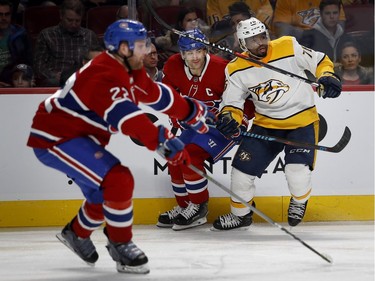 Nashville Predators defenseman P.K. Subban holds back Montreal Canadiens left wing Max Pacioretty as Montreal Canadiens defenseman Karl Alzner follows the play during HNL action in Montreal Saturday February 10, 2018.