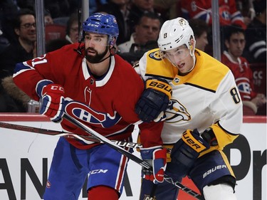 Nashville Predators center Kyle Turris struggles to get around Montreal Canadiens defenseman David Schlemko during HNL action in Montreal Saturday February 10, 2018.