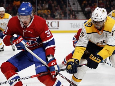 Montreal Canadiens right wing Nikita Scherbak and Nashville Predators defenseman P.K. Subban chase the puck in to the corner during HNL action in Montreal Saturday February 10, 2018.