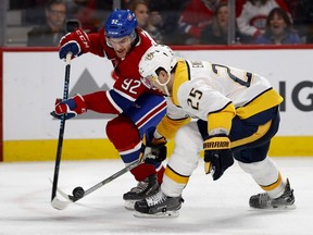 Canadiens centre Jonathan Drouin battles Nashville Predators defenceman Alexei Emelin in Montreal on Feb. 10, 2018.