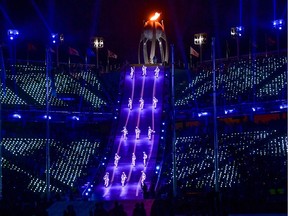 Artists perform by the Olympic flame during the closing ceremony of the Pyeongchang 2018 Winter Olympic Games at the Pyeongchang Stadium on Feb. 25, 2018.