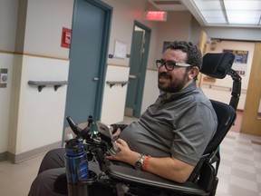 Aymen Derbali, 41, a victim of the Quebec City mosque attack, talks following rehabilitation exercises in January 2018 in Quebec City.