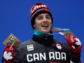 Bronze-medal winner Mark McMorris poses on the podium during the medal ceremony for the snowboard Men's Slopestyle at the Pyeongchang 2018 Winter Olympic Games on Feb. 11, 2018.