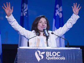 Newly acclaimed Bloc Quebecois leader Martine Ouellet salutes supporters during a rally Saturday, March 18, 2017 in Montreal.