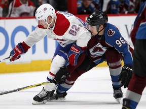 Colorado Avalanche right wing Mikko Rantanen, right, defends as Montreal Canadiens left wing Artturi Lehkonen drives to the net with the puck in the second period of an NHL hockey game Wednesday, Feb. 14, 2018, in Denver.