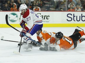 Canadiens' Alex Galchenyuk is chased on a breakaway by Flyers' Andrew Macdonald, rear, and Travis Konecny during third period Tuesday night in Philadelphia.