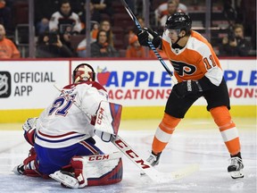Philadelphia Flyers' Travis Konecny, right, watches the puck on his goal against Montreal Canadiens' Carey Price on Thursday, Feb. 8, 2018, in Philadelphia.