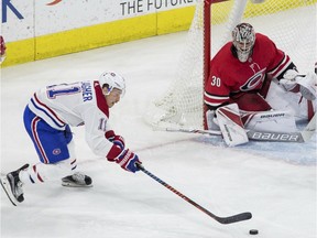 Canadiens' Brendan Gallagher reaches for the puck in effort to beat Hurricanes goalie Cam Ward Thursday night in Raleigh, N.C.