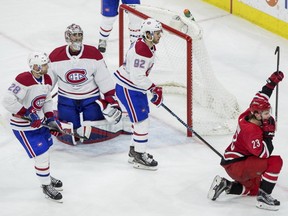 Hurricanes' Brock McGinn celebrates after scoring a goal as Canadiens' Jakub Jerabek (28), goalie Carey Price and Jonathan Drouin watch during the third period in Raleigh, N.C., on Thursday, Feb. 1, 2018.