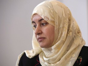 Rania El-Alloul takes part in a news conference Friday, March 27, 2015, in Montreal. The Quebec Court of Appeal has rejected a request by a Montreal judge to quash an investigation into her decision to remove a woman from her courtroom for wearing a hijab.
