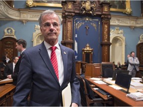 MNA Guy Ouellette walks in to make a declaration over his arrest by Quebec's anti-corruption unit at the legislature in Quebec City on October 31, 2017.