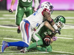 Montreal Alouettes linebacker Kyries Hebert drops Saskatchewan Roughriders wide-receiver Chad Owens in Regina on Oct. 27, 2017. Hebert was released by the Alouettes on Friday upon his request. Hebert, 37, spent the last six seasons in Montreal.