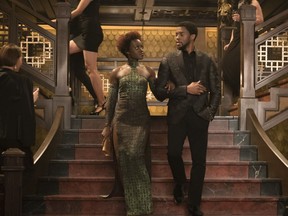 This image released by Disney shows Lupita Nyong'o, left, and Chadwick Boseman in a scene from Marvel Studios' "Black Panther."